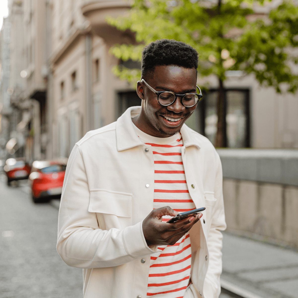 Young smiling man on his phone